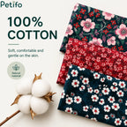 Folded samples of 100% cotton floral patterned fabrics shown alongside a raw cotton boll to highlight soft and natural material.