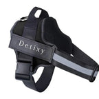 A solid black reflective dog harness featuring durable black nylon straps, a top control handle, a quick-release buckle, and a "Detixy" identification patch.