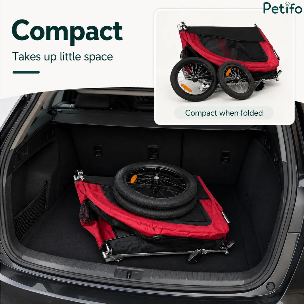 The Petifo red pet stroller compactly folded and stored inside the trunk of a car.
