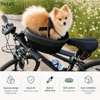 Fluffy Pomeranian dog sitting safely inside a black Petifo pet bike basket mounted on a bicycle during an outdoor ride.