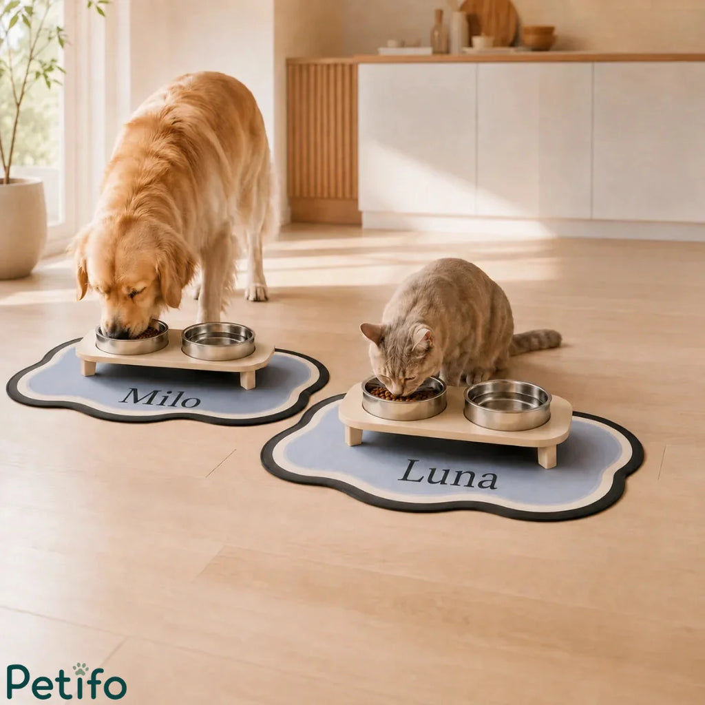 Golden retriever and cat enjoying a meal from personalized wooden raised pet feeders on custom name mats in a modern kitchen.