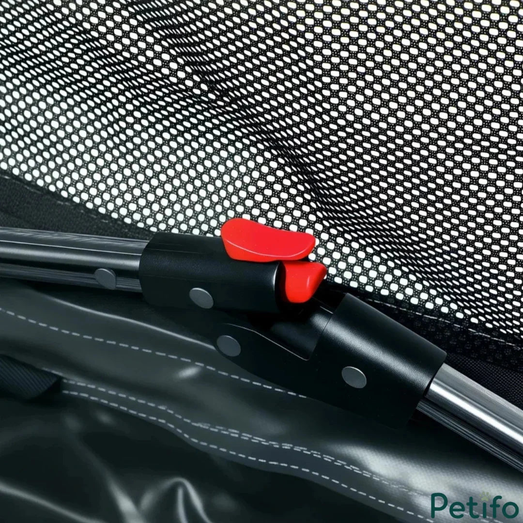 Close-up of the durable frame locking mechanism featuring a bright red release button for easy folding.