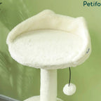 Close-up view of the plush cat-ear-shaped top observation bed and dangling pom-pom toy on the scratching post tower.