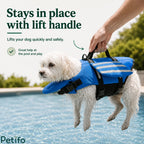Person lifting a small white dog out of a swimming pool using the sturdy top handle of a blue life vest.