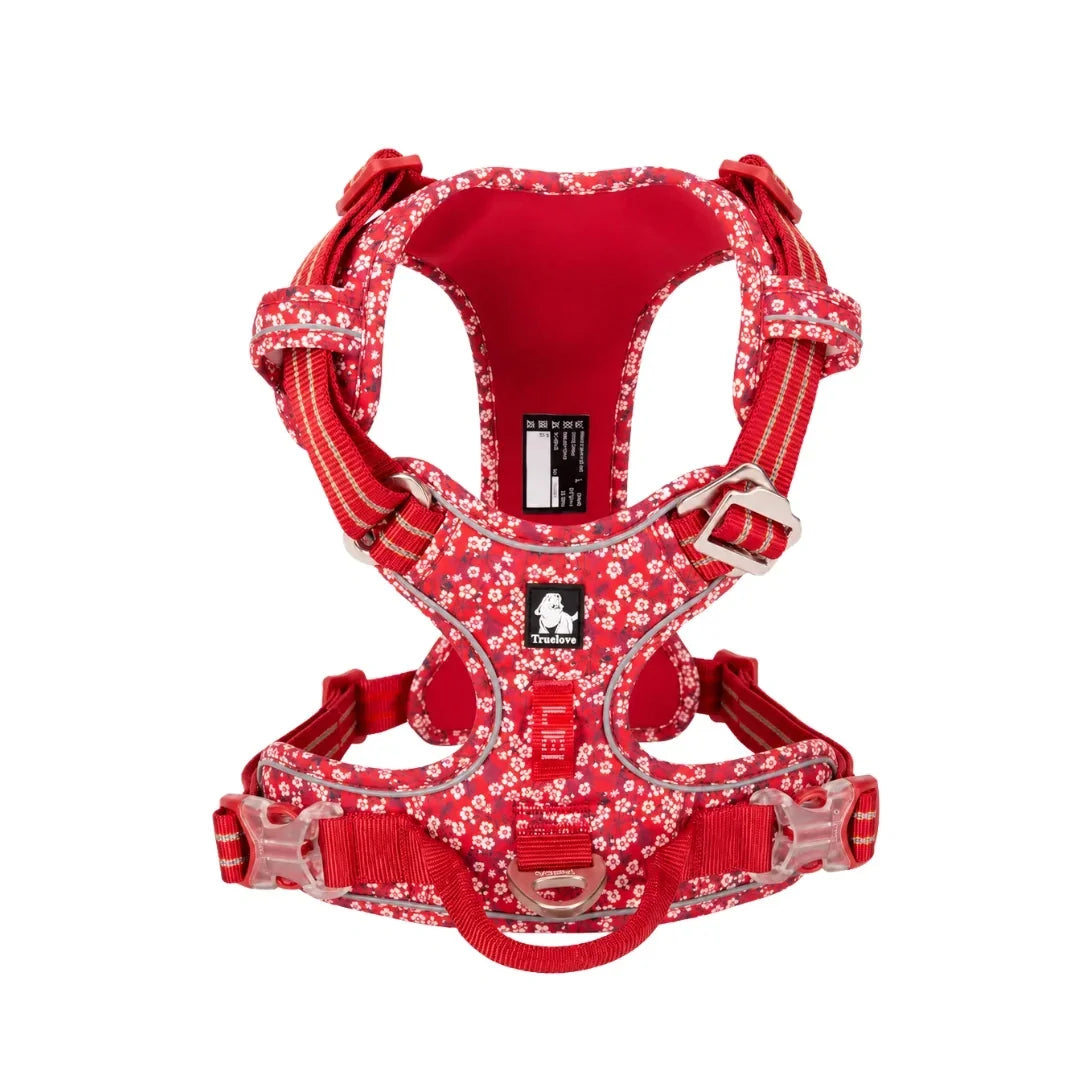 Front view of the vibrant red floral step-in dog harness featuring reflective trim and a sturdy metal D-ring.